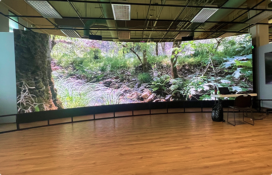 The curved Hyperwall on display at The Earth Information Center's display at the Smithsonion National Museum of Natural History.